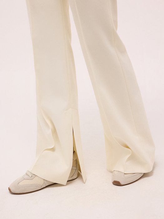 Расклешенные брюки с разрезами: фото №4