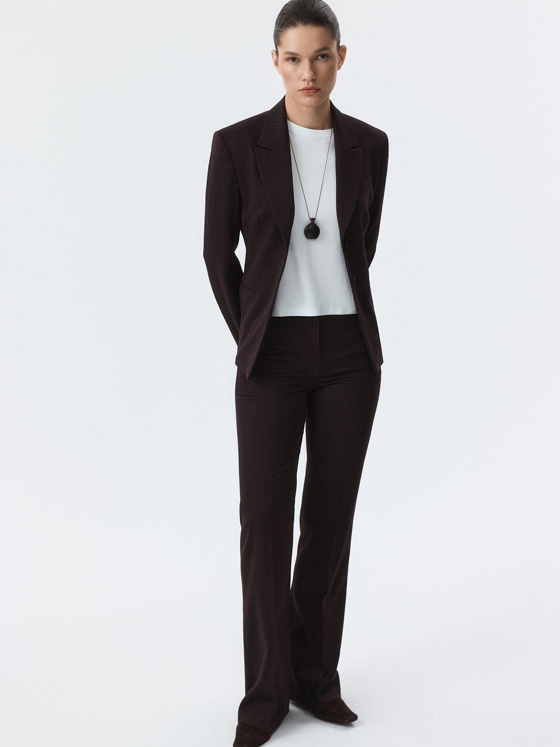 Расклешенные брюки в полоску: фото №1