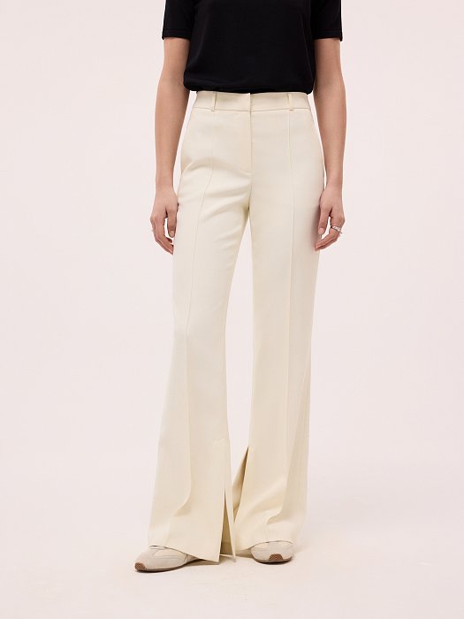 Расклешенные брюки с разрезами: фото №2