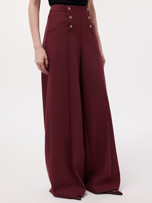 Широкие брюки с декоративными пуговицами: фото №3