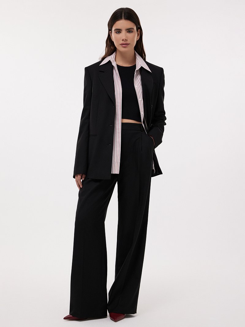 Удлиненные брюки с защипами