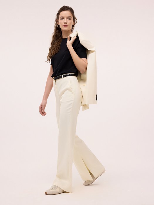 Расклешенные брюки с разрезами: фото №6