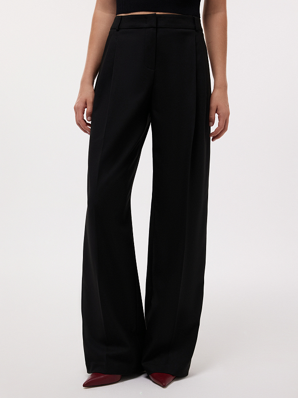 Удлиненные брюки с защипами