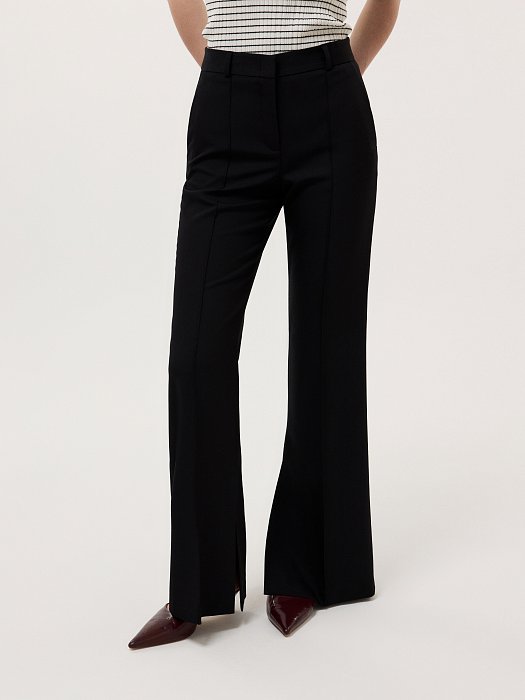 Расклешенные брюки с разрезами: фото №2