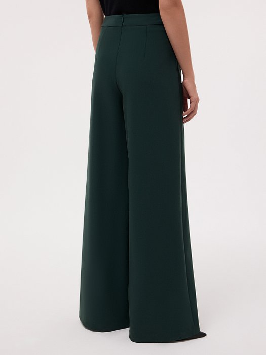 Широкие брюки с декоративными пуговицами: фото №4