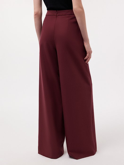 Широкие брюки с декоративными пуговицами: фото №4